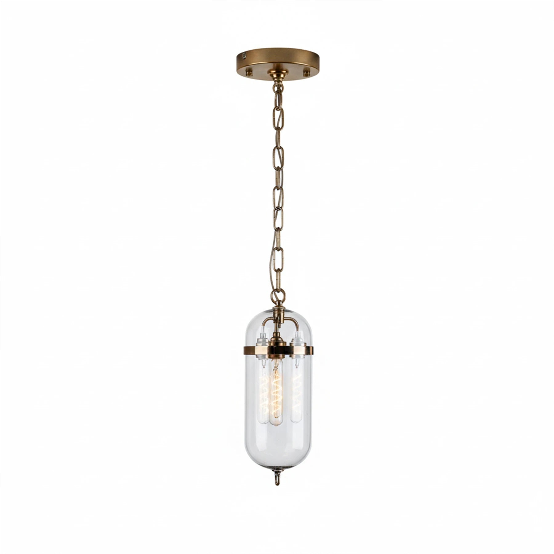 Pendant light with glass shade and brass fixture on a white background