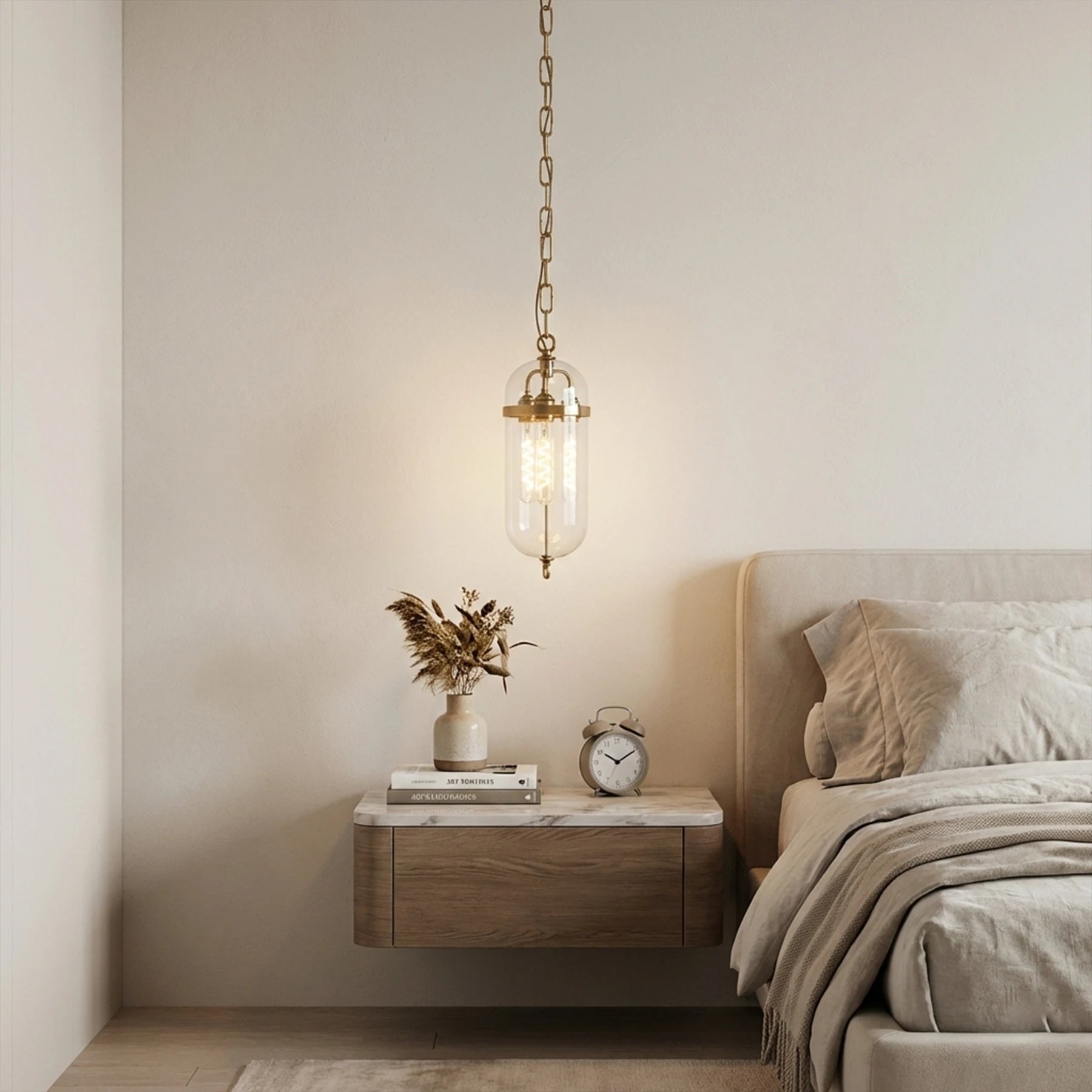 Modern bedroom with a floating nightstand, pendant light, and decorative items.