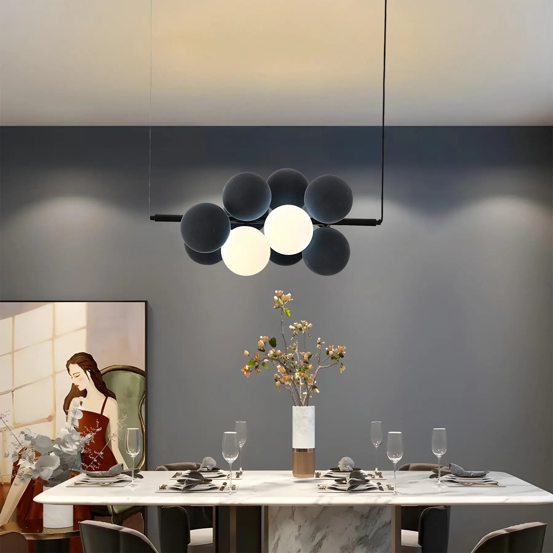 Name Abeeha Celestial Orb Pendant Light in midnight black and white, featuring a modern 10-bulb design with spherical globes on a black metal frame, illuminating a stylish dining 