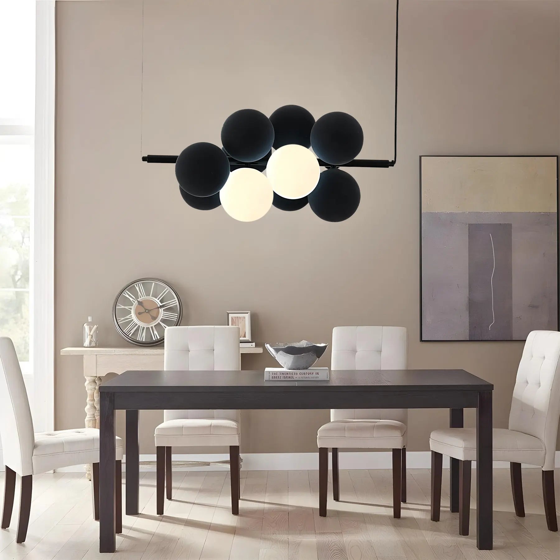 Name Abeeha Celestial Orb Pendant Light in midnight black and white, featuring a modern 10-bulb design with spherical globes on a black metal frame, illuminating a stylish dining 